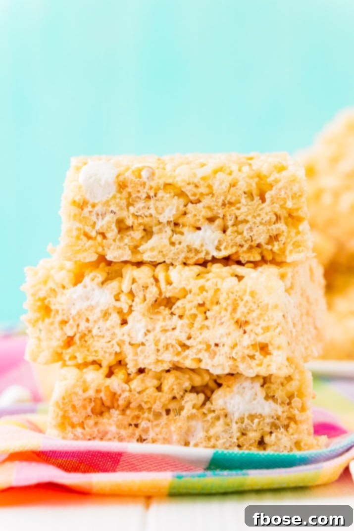 Sweet Crispy Mallow Squares 2 Gooey, chewy Rice Krispie Treats loaded with salty butter, sweet marshmallow, and crunchy cereal, an irresistible easy no-bake dessert ready in less than 30 minutes!