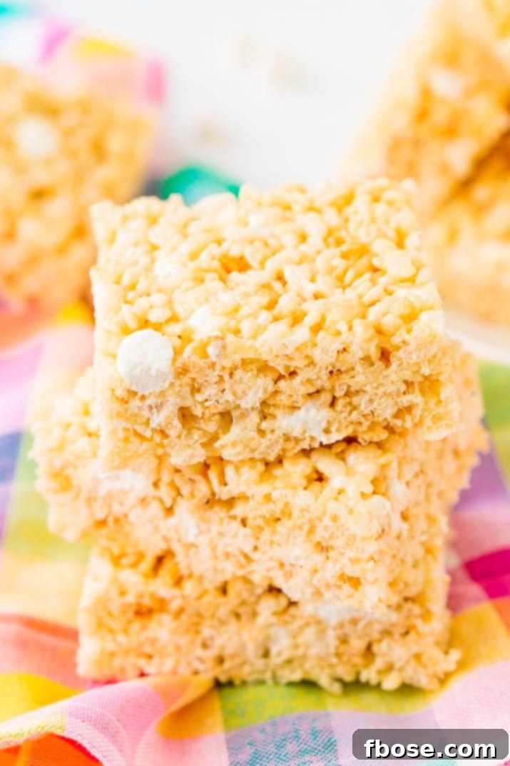Sweet Crispy Mallow Squares 4 Delicious Rice Krispie Treats recipe, featuring salty butter, sweet marshmallow, and crunchy cereal, a no-bake dessert that's quick and irresistible.