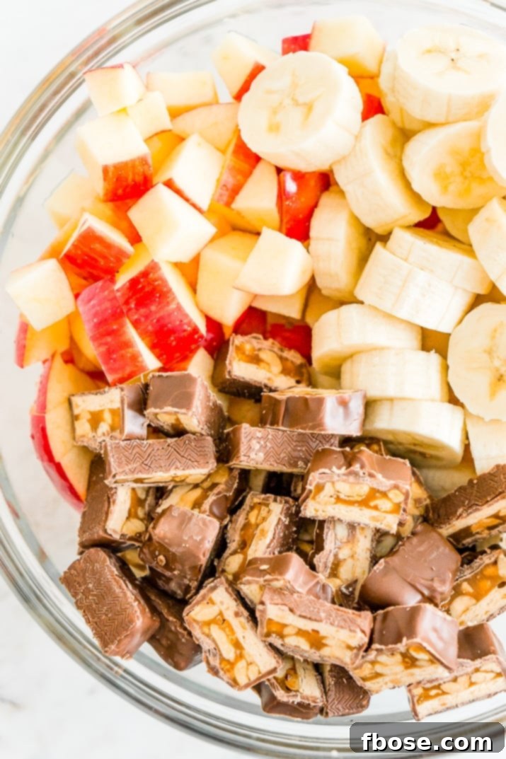 Snickers Salad 3 This Snickers Salad is an easy and addictive 4-ingredient no-bake dessert salad made with Snickers, banana, apples, and Cool Whip!