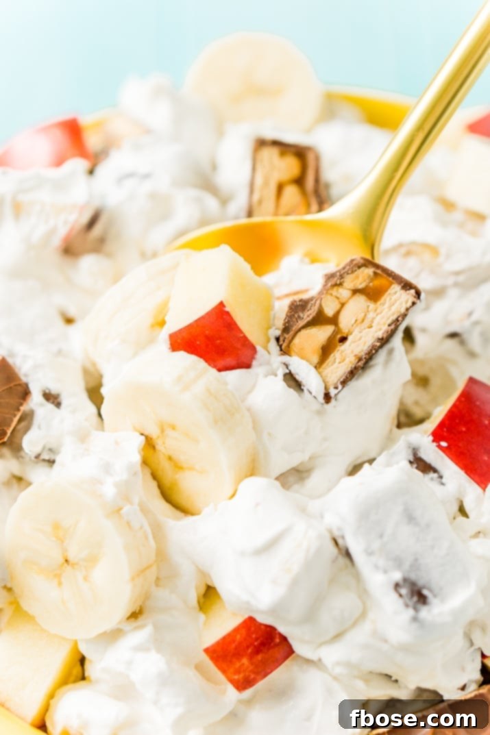 Snickers Salad 5 This Snickers Salad is an easy and addictive 4-ingredient no-bake dessert salad made with Snickers, banana, apples, and Cool Whip!
