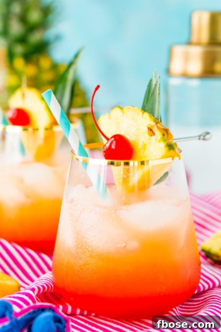A beautifully crafted Mai Tai cocktail, garnished with a pineapple wedge and maraschino cherry, perfect for a summer day.