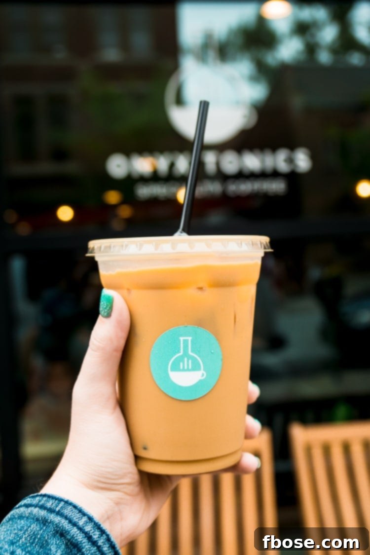 Unlocking Burlington: Essential Experiences in Vermont 11 A thoughtfully designed to-go coffee cup from Onyx Tonics Specialty Coffee, symbolizing quality and craftsmanship in Burlington's coffee scene.
