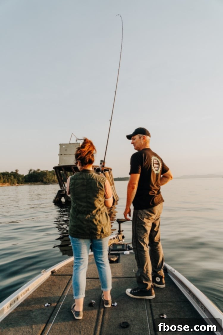 Unlocking Burlington: Essential Experiences in Vermont 15 A person casting a fishing rod from a boat on Lake Champlain, highlighting outdoor recreational opportunities near Burlington.