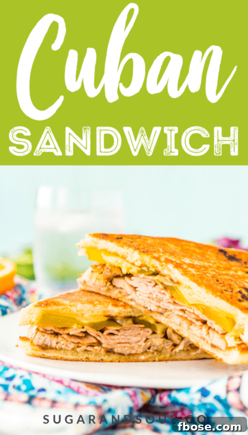 This Cuban Sandwich is loaded with smoked ham, swiss cheese, mojo pork, mustard, and pickles, and then grilled to melty perfection! Pin this recipe for future use.