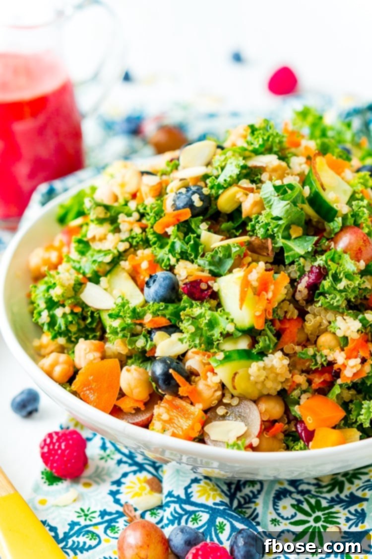Chopped Kale Salad is loaded with kale, red grapes, orange bell peppers, white quinoa, grated carrots, European cucumbers, Craisins, and sliced almonds. Enjoy it as a wholesome side dish or top with chicken or chickpeas for a light and satisfying meal.