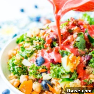 Raspberry Vinaigrette Dressing is delicious on summer salads and made with fresh raspberries, honey, red wine vinegar, olive oil, sea salt, black pepper, and garlic powder.