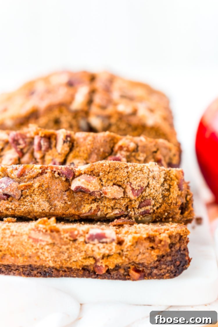 Delightful homemade Applesauce Bread, perfectly moist and spiced, featuring brown sugar and pecans - ideal for fall baking and sharing.