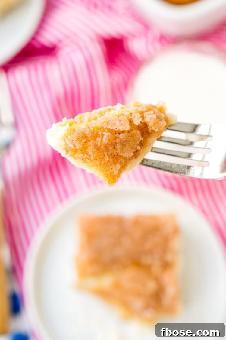 Effortless Sopapilla Cheesecake 5 A perfectly sliced Sopapilla Cheesecake Recipe bar, ready for serving.