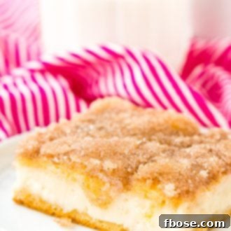 Sopapilla Cheesecake is a Spanish-inspired dessert made with crescent roll dough, cream cheese, cinnamon, sugar, butter, and a drizzle of honey.