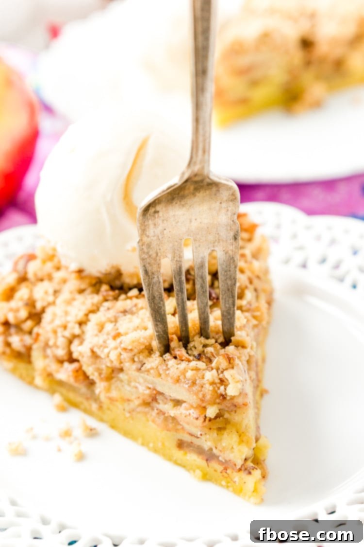 A freshly baked Impossible French Apple Pie, cooling on a wire rack.