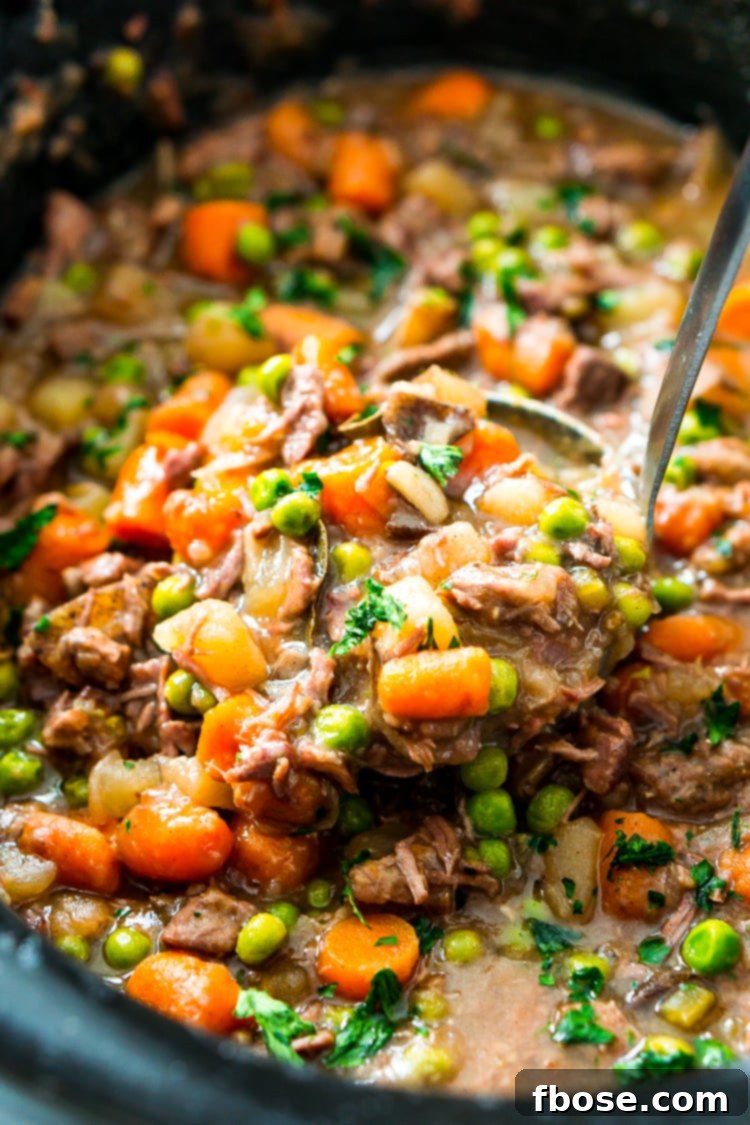 Tender Slow-Cooked Beef Stew 3 Close-up of the rich, thick broth and ingredients of a Crock Pot Beef Stew as it simmers.