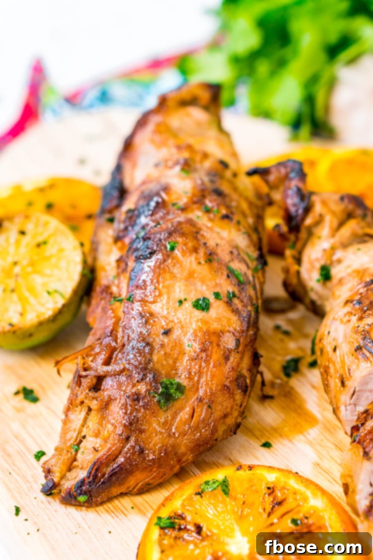 Perfectly cooked and sliced Cuban Mojo Pork tenderloin, ready to be served as an entree.