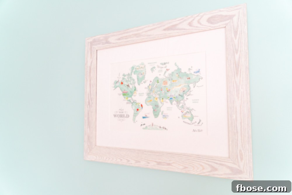 A beautifully framed, animated style world map for a child's room, adding a global touch to the nursery decor.