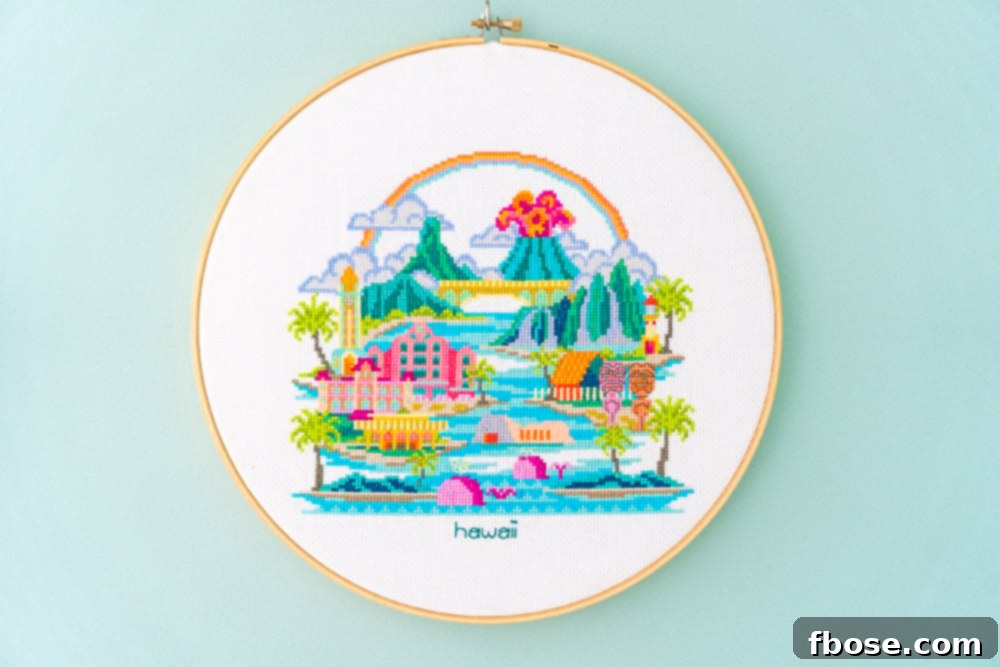 Tropical Hawaii cross-stitch hoop art, featuring lush palm trees and surfboards, evoking a serene island paradise for the nursery.