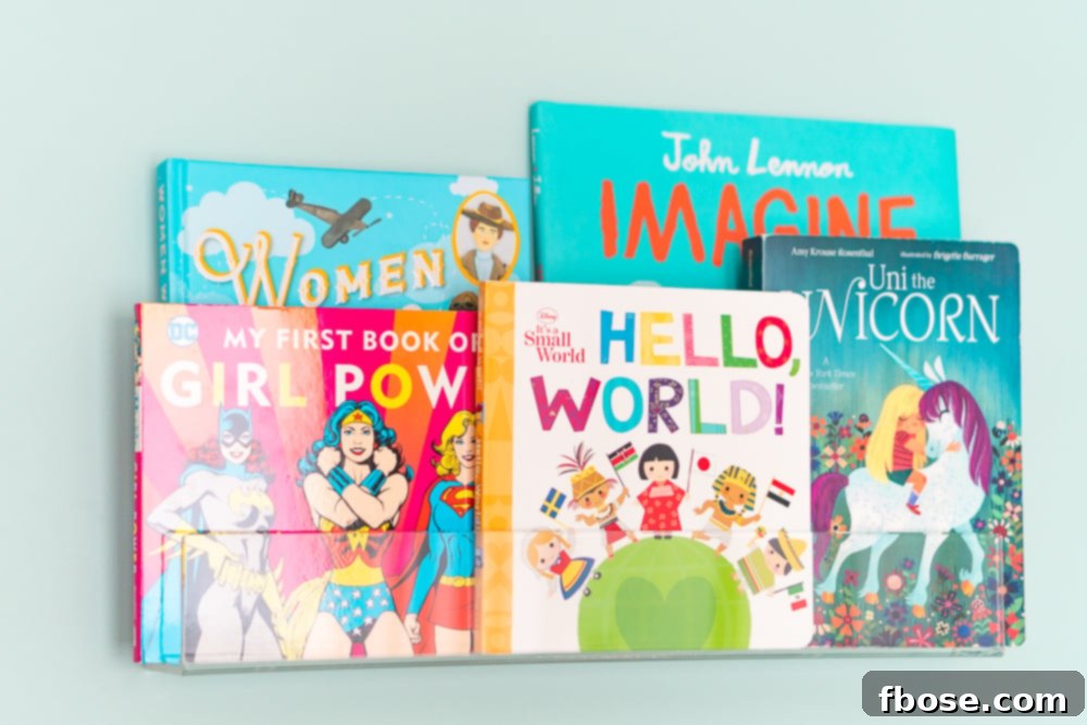 Modern acrylic bookshelves filled with a colorful selection of children's books, adding a functional and aesthetic touch to the nursery.
