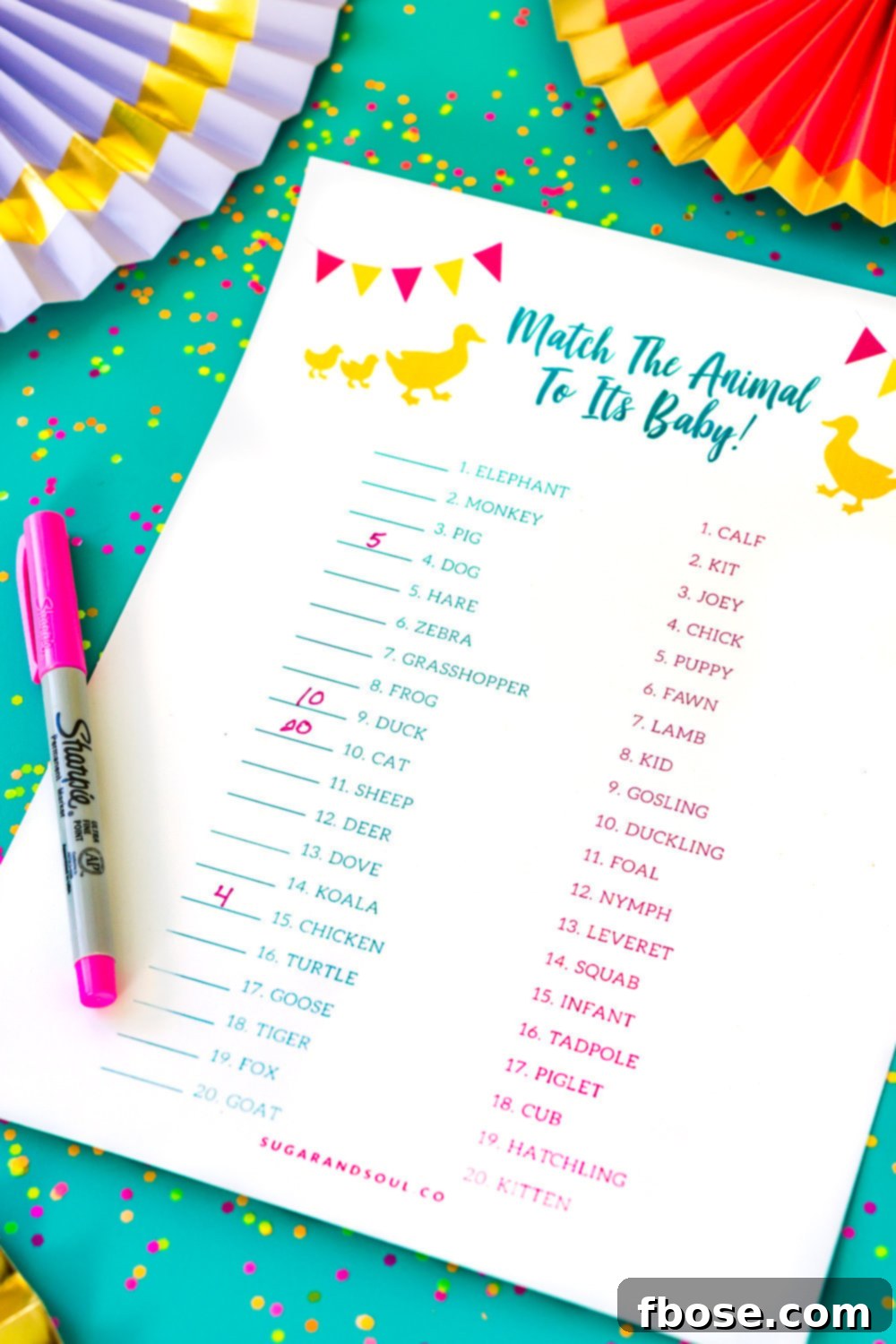 Baby Shower Mama Match Game Printable 3 Guests actively playing the 'Are You My Mother?' Baby Shower Game. A vibrant and free printable game that's super tricky and educational for baby shower fun.