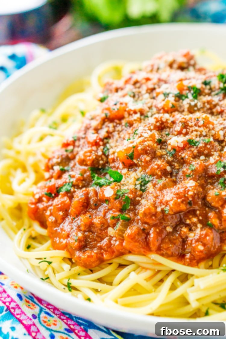 A simmering pot of rich and meaty homemade spaghetti bolognese sauce, ready to be served over pasta.