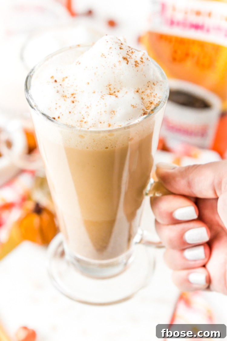 Enjoying a homemade Pumpkin Spice Latte with rich bold coffee and frothy milk