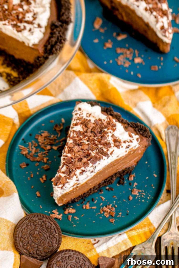 Velvet Chocolate Indulgence 6 slices of chocolate cream pies on blue plates on yellow checkered napkins.