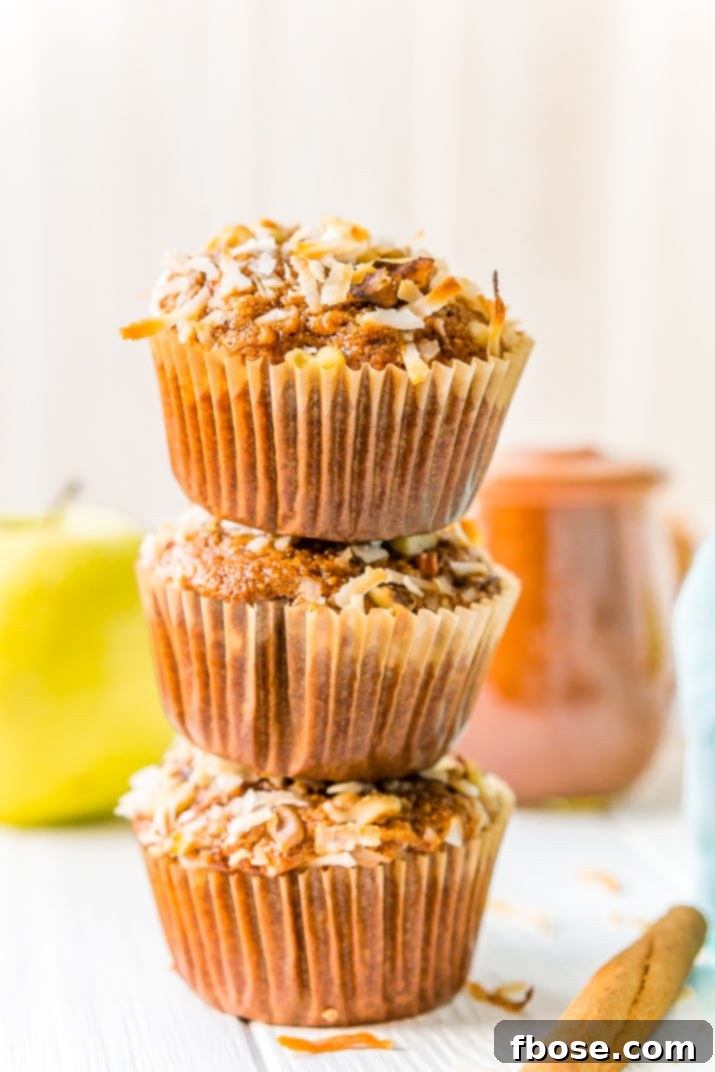 A tray of golden-brown Morning Glory Muffins, freshly baked and ready to be enjoyed, showcasing their inviting texture.
