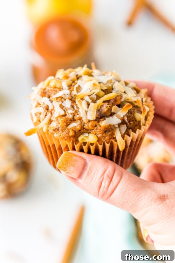 Morning Glory Muffins stacked on a plate, ready to be served for a delightful breakfast or snack.