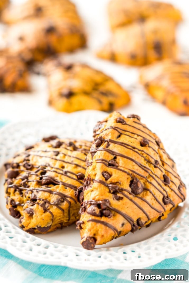 Delicious Homemade Pumpkin Scones with Chocolate Chips – A sophisticated fall treat featuring pumpkin and spice, perfect for breakfast, brunch, or an afternoon pick-me-up.