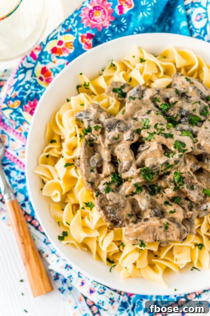 Beef Stroganoff is a delicious dinner recipe made with tender ribeye steak sautéed in a buttery mushroom and sour cream sauce and served over egg noodles.