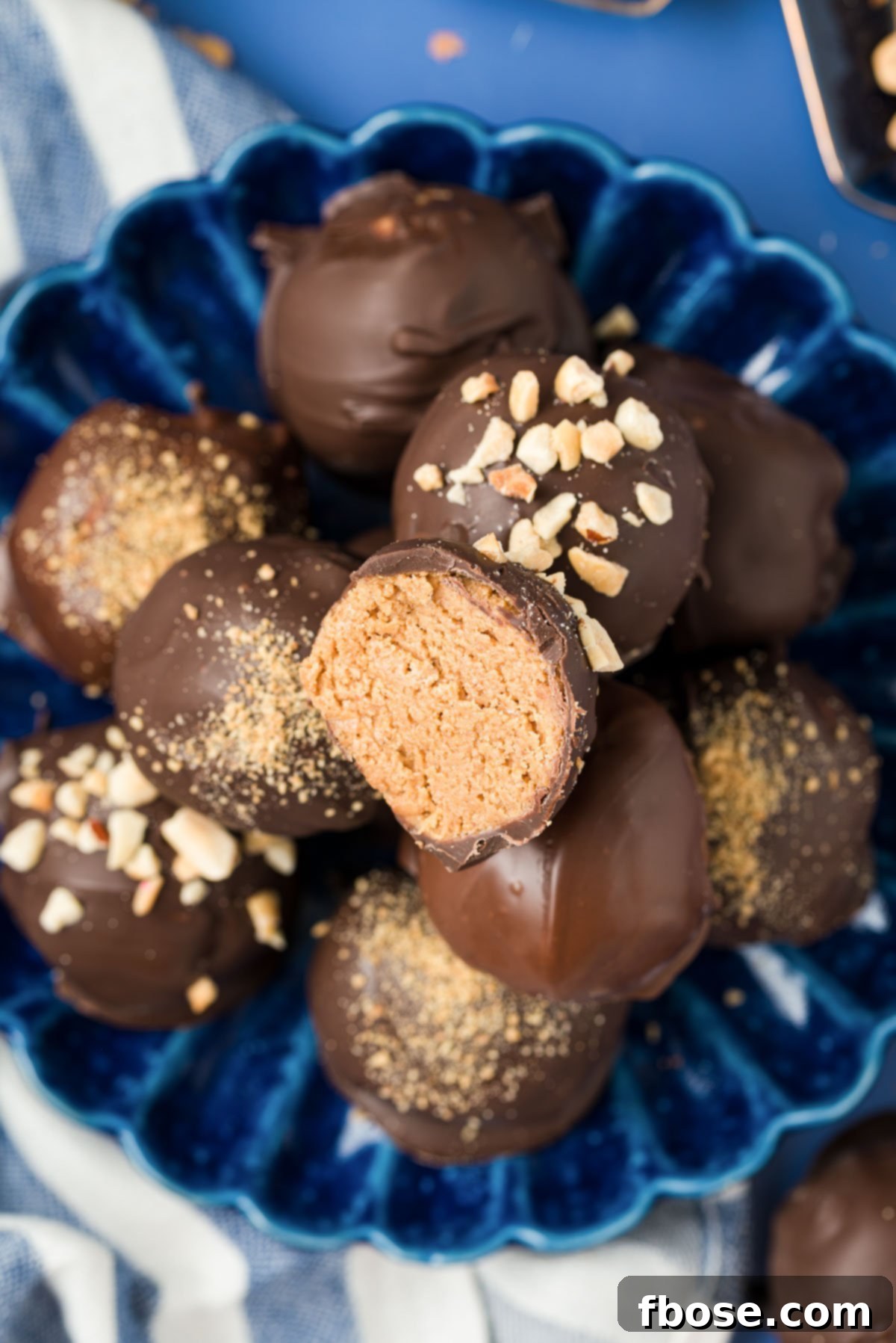 Chilled Peanut Butter Bliss Balls 7 Overhead photo of a blue plate with peanut butter balls on it.