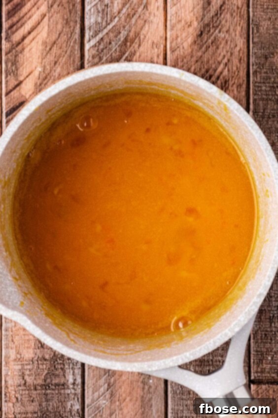 Egg and sugar in a pot.