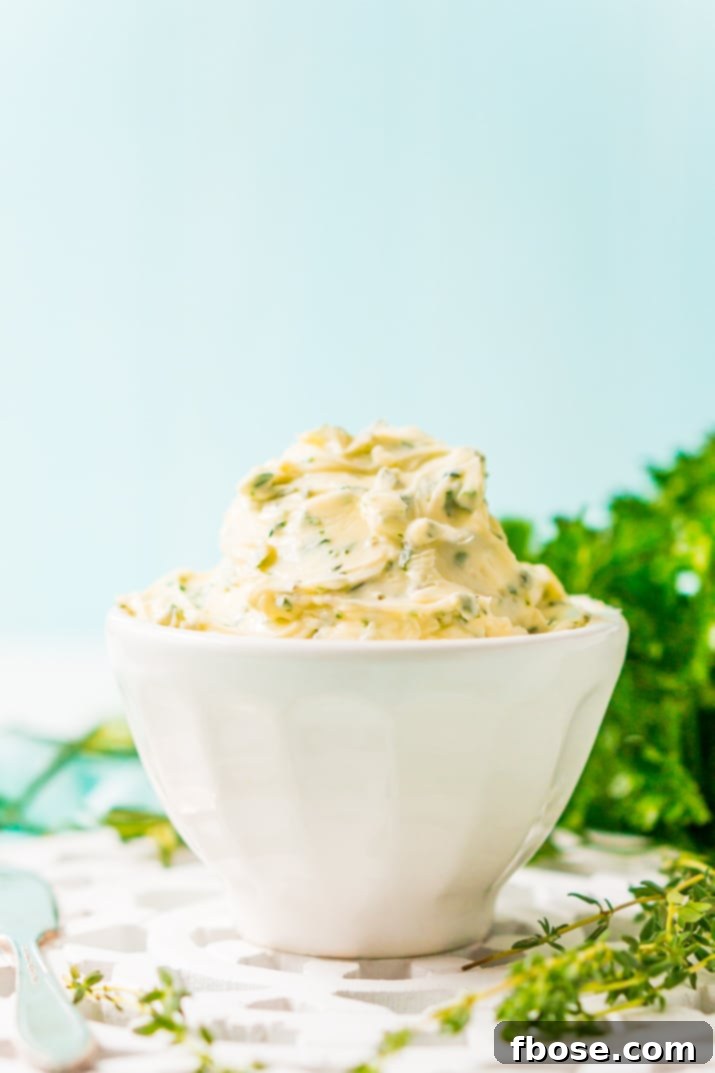This savory Herb Butter is infused with parsley, thyme, rosemary, black pepper, and lemon zest for a flavorful spread that tastes delicious on garlic bread, dinner rolls, steak, and more!