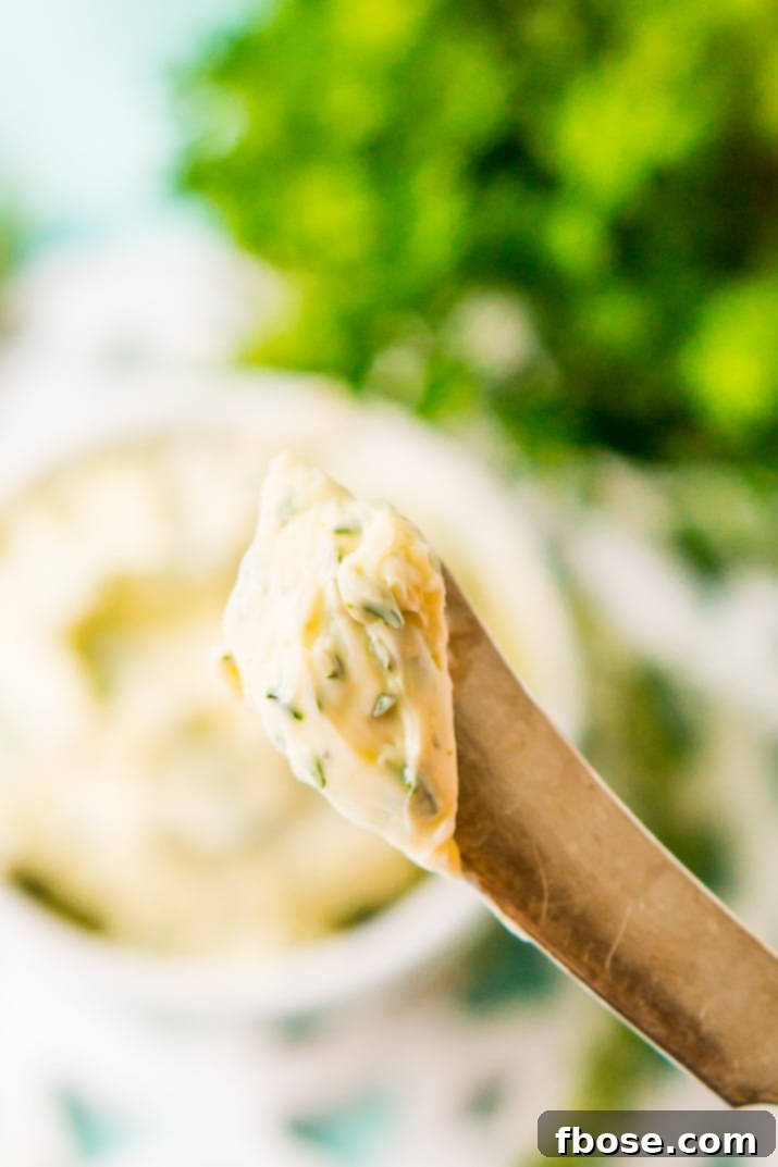 This savory Herb Butter is infused with parsley, thyme, rosemary, black pepper, and lemon zest for a flavorful spread that tastes delicious on garlic bread, dinner rolls, steak, and more!