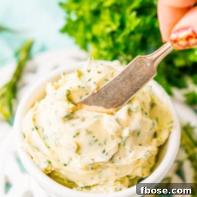 This savory Herb Butter is infused with parsley, thyme, rosemary, black pepper, and lemon zest for a flavorful spread that tastes delicious on garlic bread, dinner rolls, steak, and more!