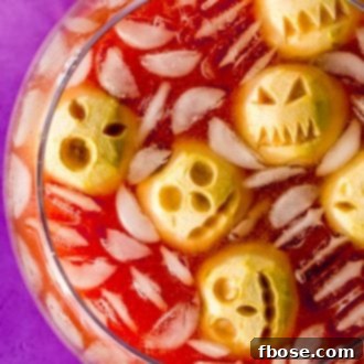 Baked apple shrunken head floating in the punch