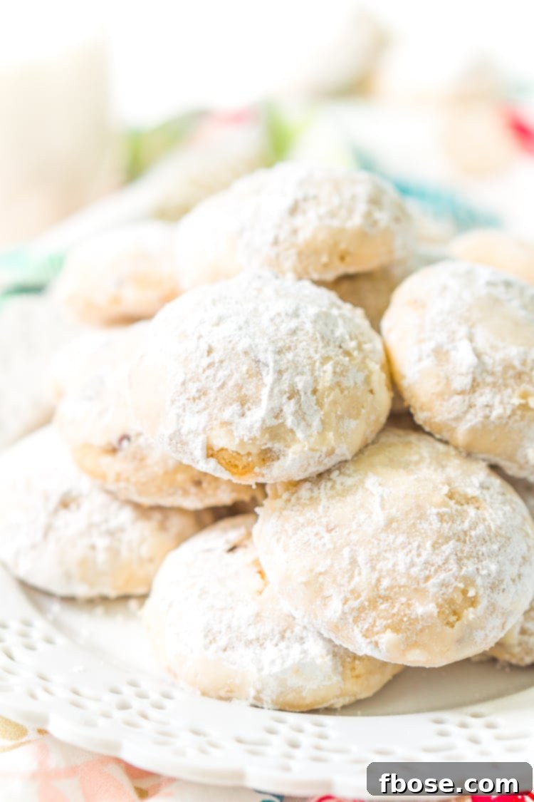 Snowball Cookies are a classic and a staple at holiday cookie exchanges. Made with butter, flour, sugar, vanilla, and chopped pecans, they're a delicious and addictive dessert!