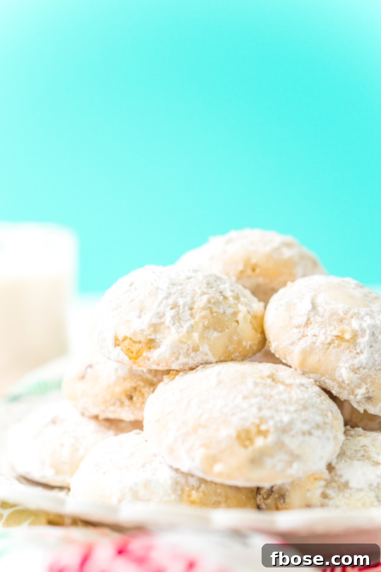 Snowball Cookies are a classic and a staple at holiday cookie exchanges. Made with butter, flour, sugar, vanilla, and chopped pecans, they're a delicious and addictive dessert!