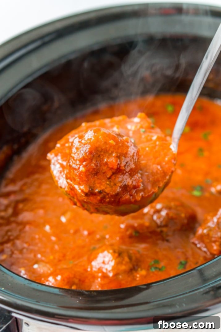 These Crockpot Meatballs are the ultimate slow-cooked dinner. Enjoy homemade Italian Meatballs in a rich tomato sauce, just add your favorite pasta or make subs!