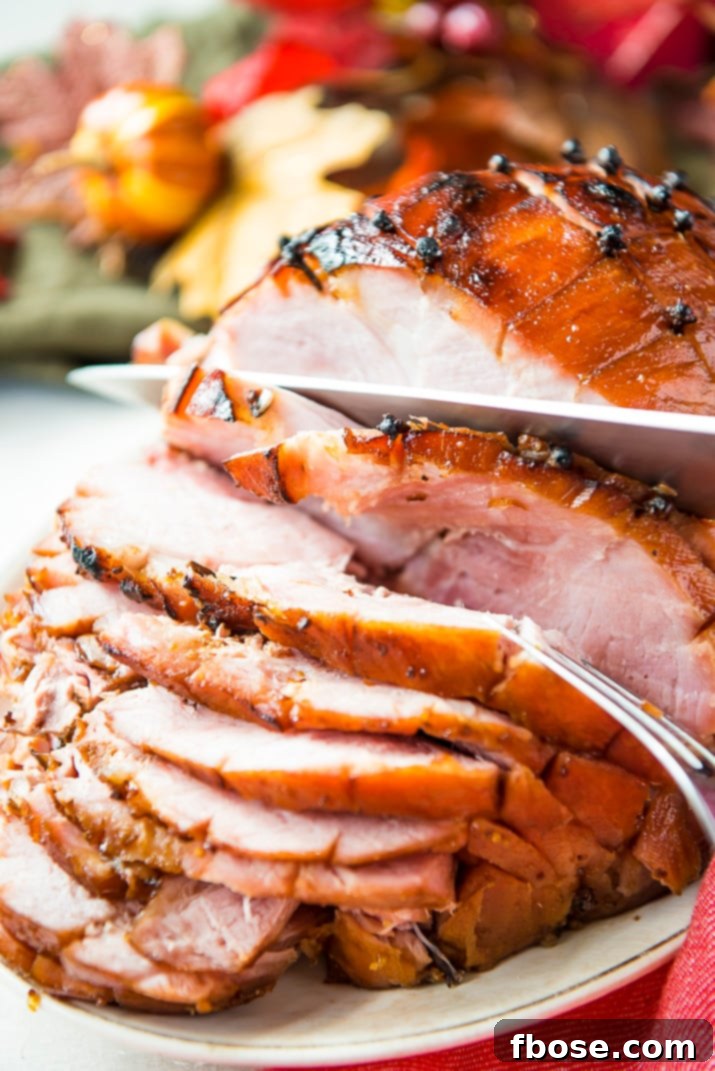 Maple Glazed Ham with festive side dishes, showcasing a complete holiday meal presentation.