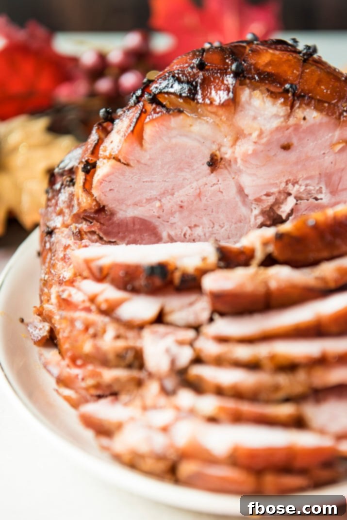 A serving of perfectly glazed ham, glistening and ready to be enjoyed.