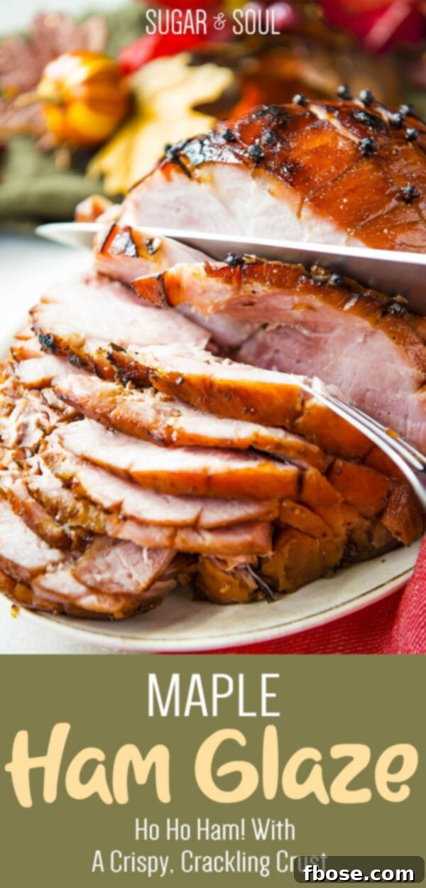 A festive holiday ham, beautifully prepared with maple glaze, set on a serving platter with garnishes.
