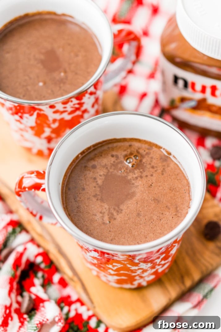 Nutella Hot Chocolate garnished with mini marshmallows and chocolate sprinkles, ready to be enjoyed.
