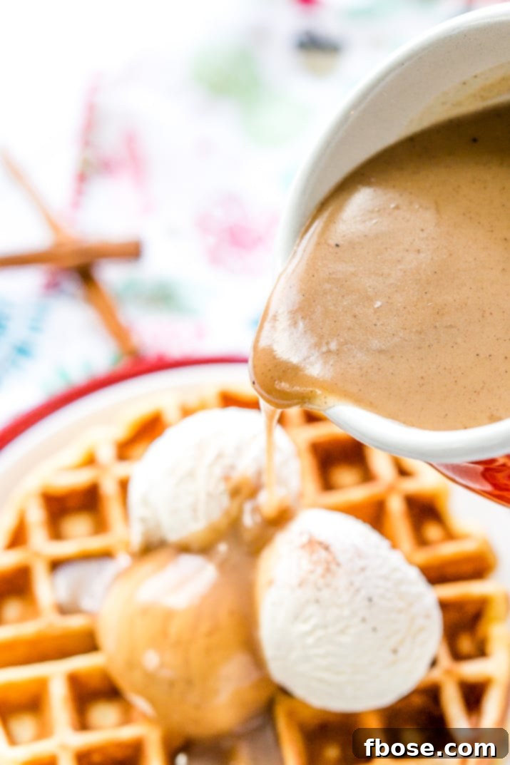 Ingredients for Spiced Vanilla Syrup laid out on a rustic wooden surface, including butter, brown sugar, half & half, vanilla paste, cinnamon, nutmeg, and allspice.
