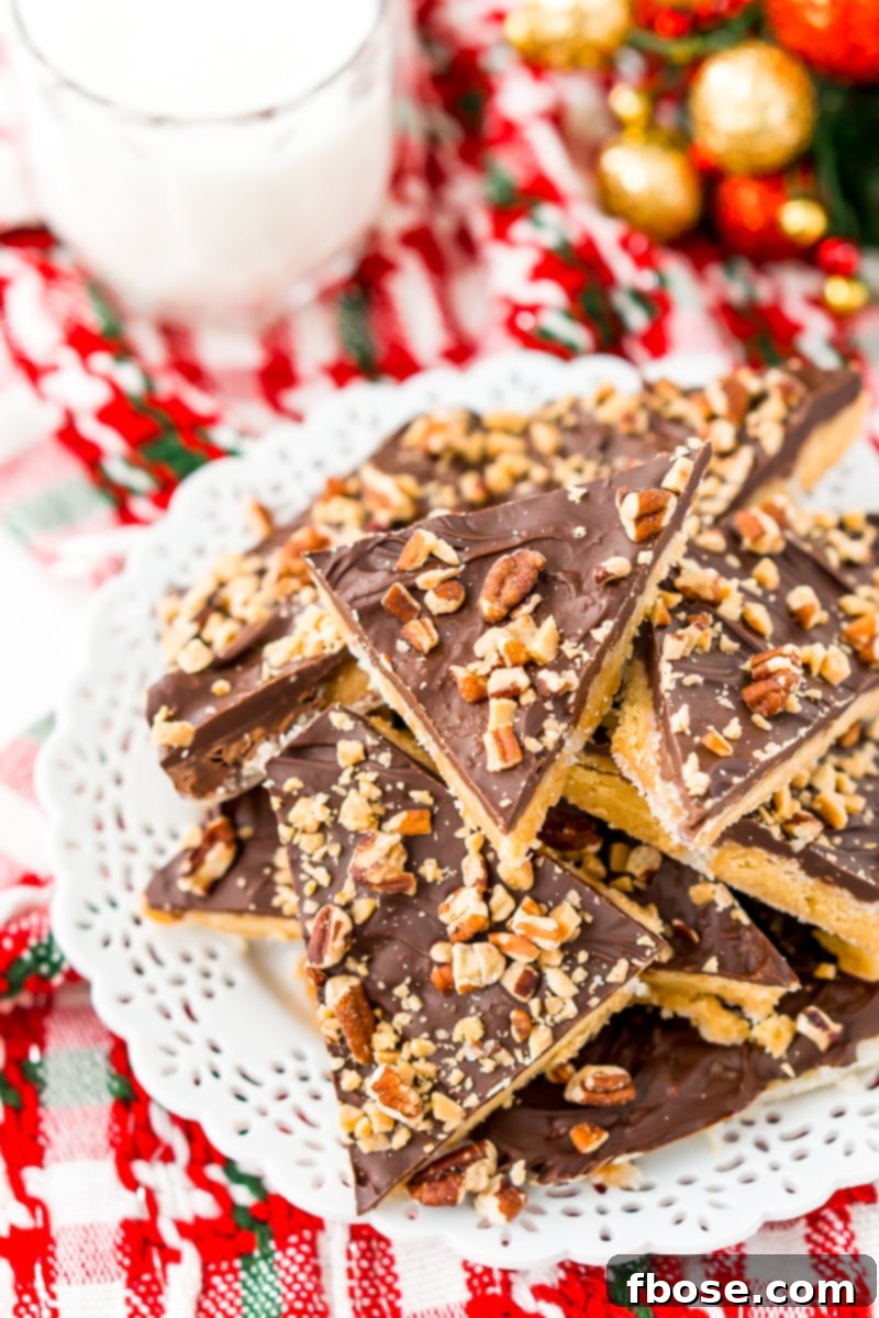 This Shortbread Christmas Crack is insanely easy to make and even more delicious! Made with shortbread cookies, butter, sugar, chocolate, pecans, and toffee bits.