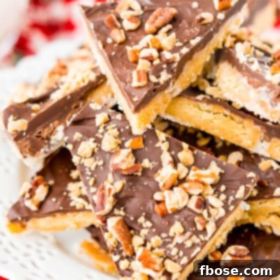 This Shortbread Christmas Crack is insanely easy to make and even more delicious! Made with shortbread cookies, butter, sugar, chocolate, pecans, and toffee bits.