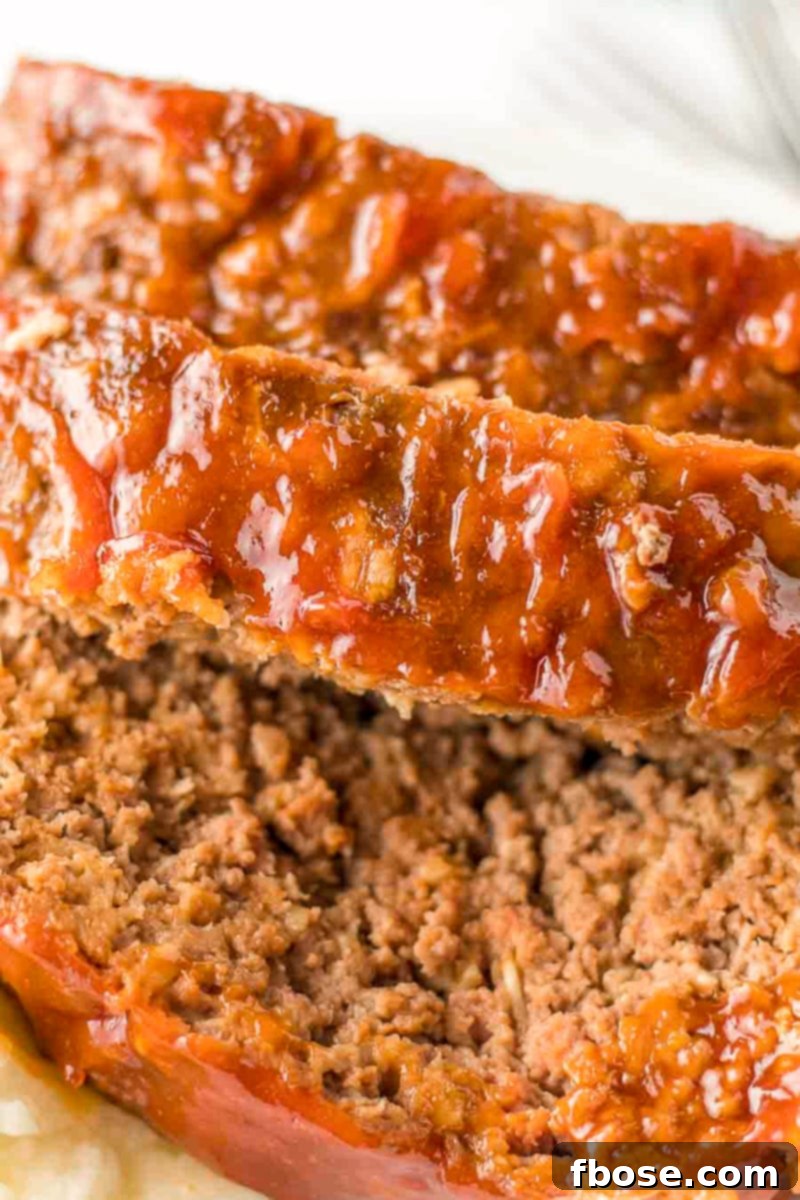 Whole meatloaf ready to be sliced, showcasing the perfect glaze.