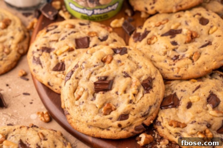 Chunky Monkey Pudding Cookies on a wooden board.