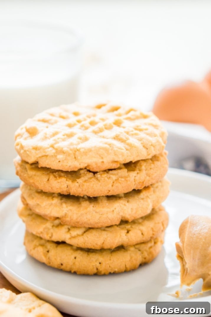 These Peanut Butter Cookies are the classic cookie you all know and love with a secret ingredient that leaves them extra chewy and delicious!