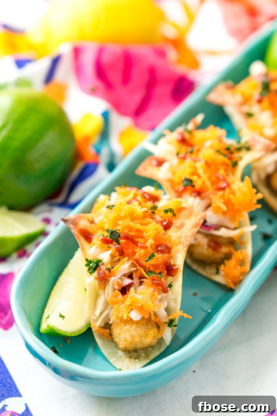 Delicious Fish Stick Tacos, featuring crispy wontons, breaded fish, and a fresh Asian slaw, perfect for any party.
