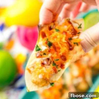 Close-up of a single Fish Stick Wonton Taco, ready to be enjoyed.