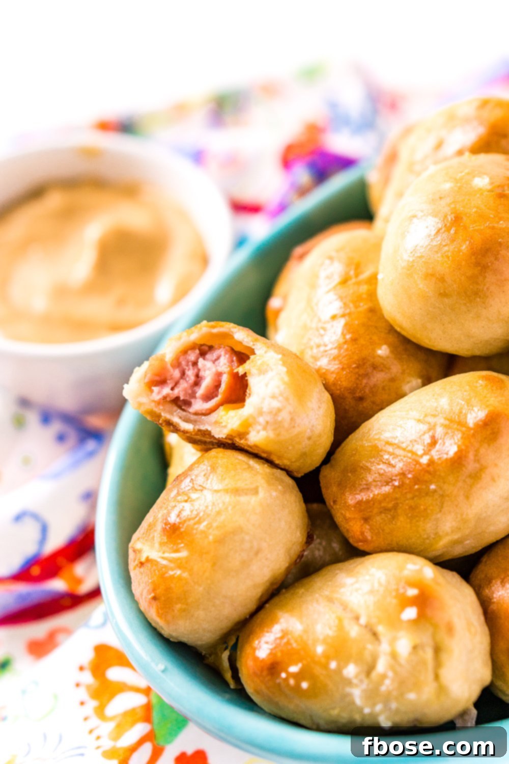 These Pretzel Pigs In A Blanket take two of your favorite party foods and combine them into one!