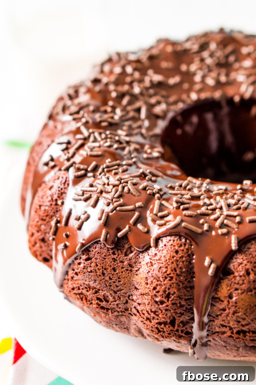 A beautifully baked Healthier Chocolate Yogurt Cake, a lightened-up but still indulgent bundt cake made with applesauce and yogurt, presented invitingly.